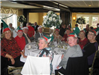 Attendees Sitting at Table with Elf Hats