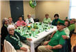 Group Sitting at the Table and Smiling for the Camera (2)