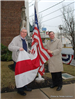 Men Posing with Flag for Picture (2)
