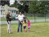 Man and His Children Speaking with Police Officer