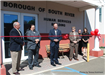 Representatives in Front of Ribbon Cutting