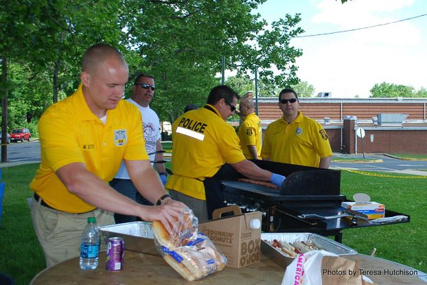 Police Making Food for Attendees