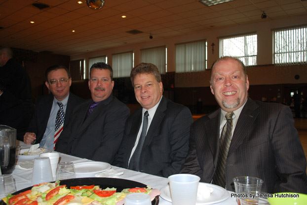 Four Men Smiling for Camera